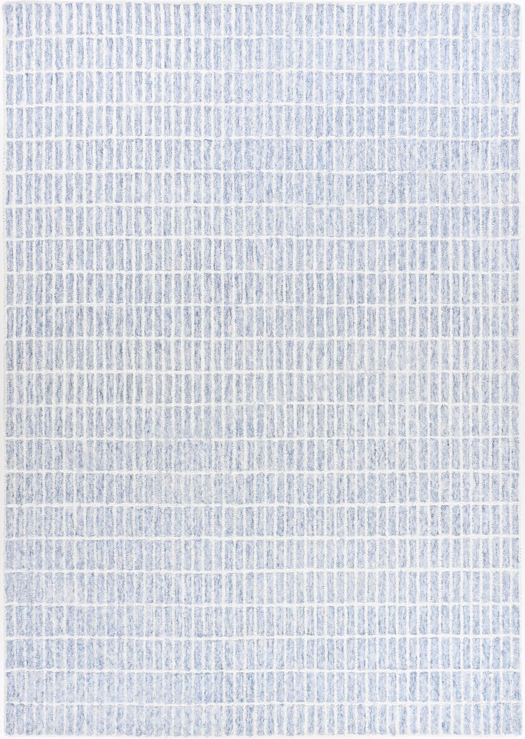 Close-up textured blue-white hand-tufted wool rug.