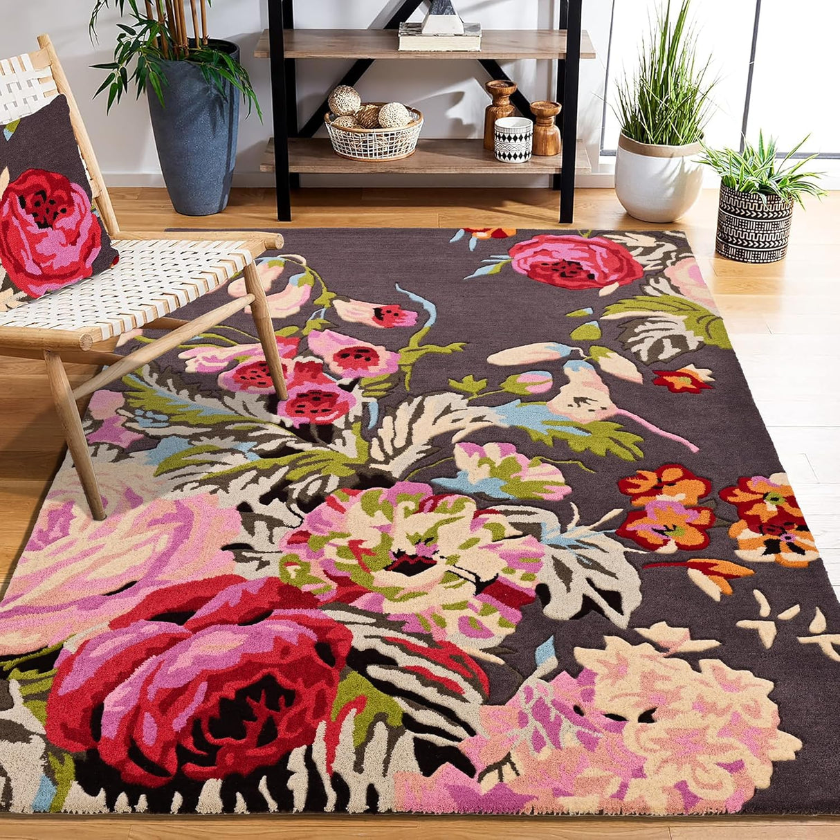Brown floral rug with pink, red, orange flowers, green leaves.