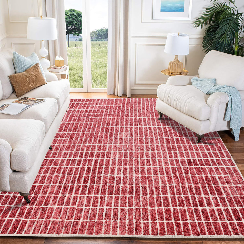 Modern living room with white sofa, red grid rug.